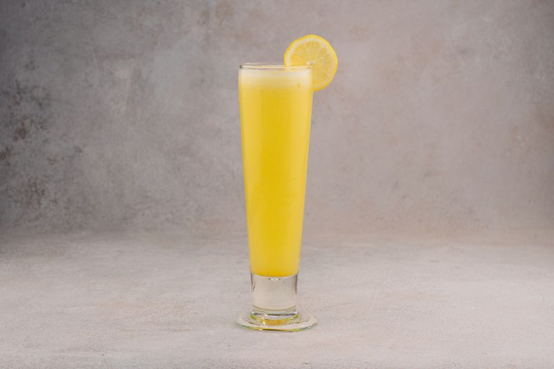 Fresh lemonade with mint and ice on table